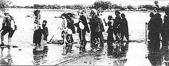 Flood caused by dyke burst, pictured are evacuated refugees