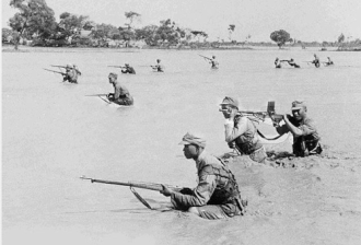 National Revolutionary officers and soldiers fighting in the mud and water in th